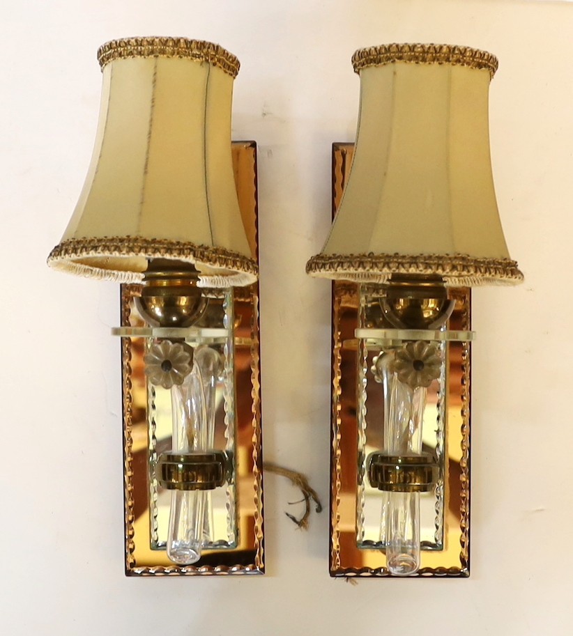 A pair of 1930s French mirrored glass wall lights, height 25cm